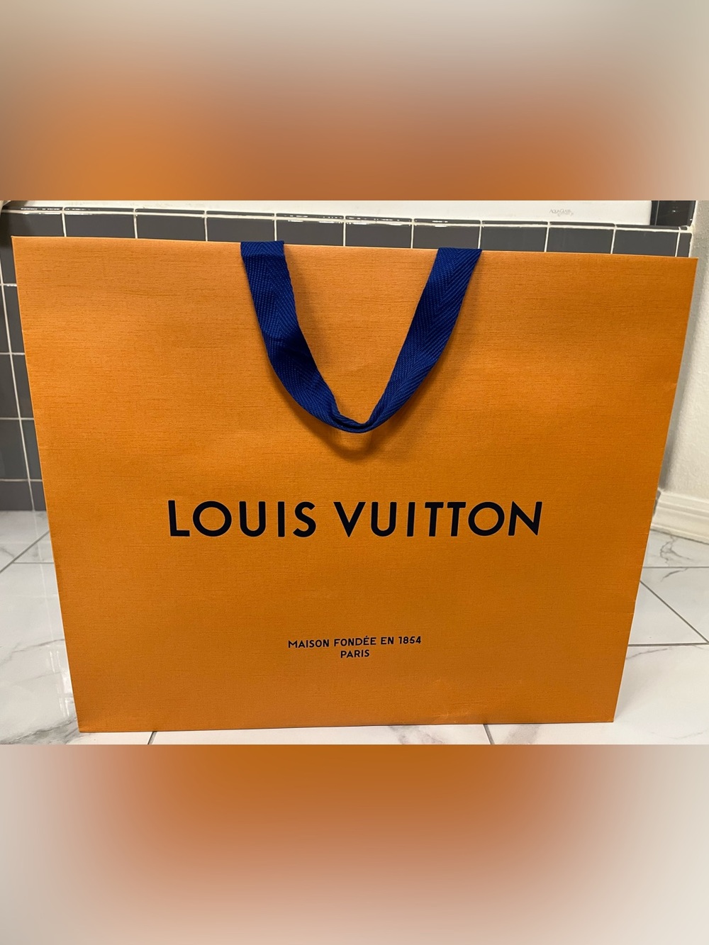 Authentic Louis Vuitton Orange Bag with Blue Ribbon Handles